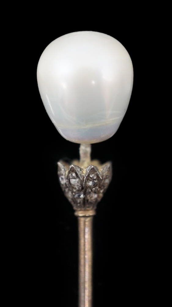 A Victorian gold, single stone part drilled natural saltwater pearl and rose cut diamond chip set stick pin